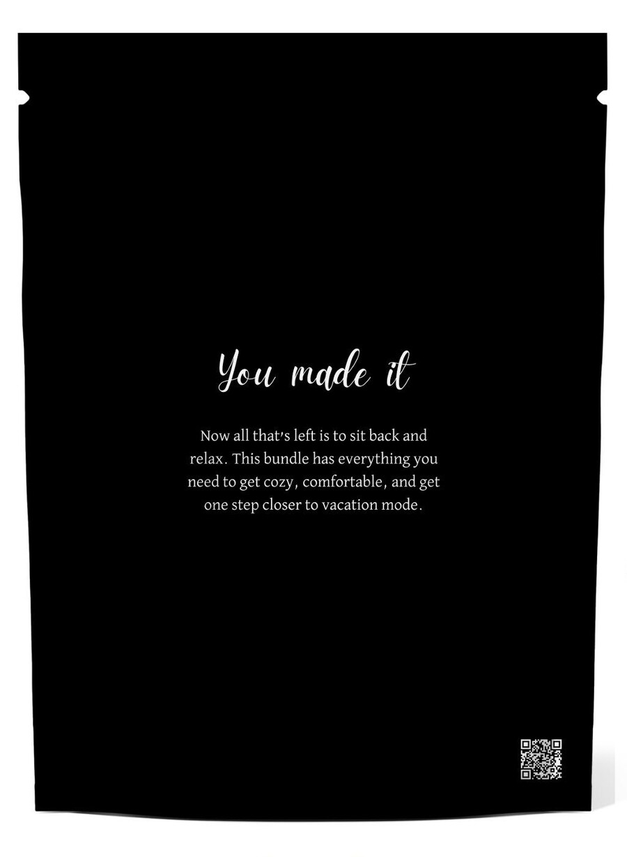 Back of a black branded pouch reading You made it, with welcome copy and a QR code