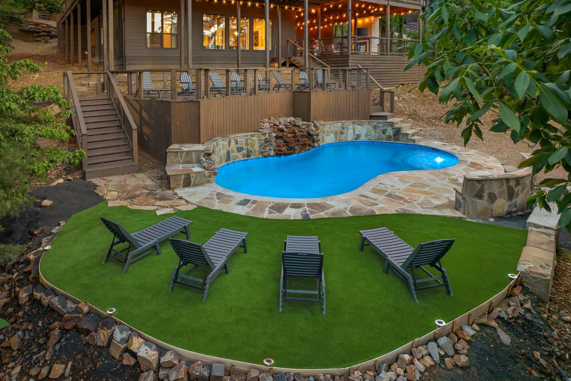Poolside deck and loungers at a client cabin we service at dusk