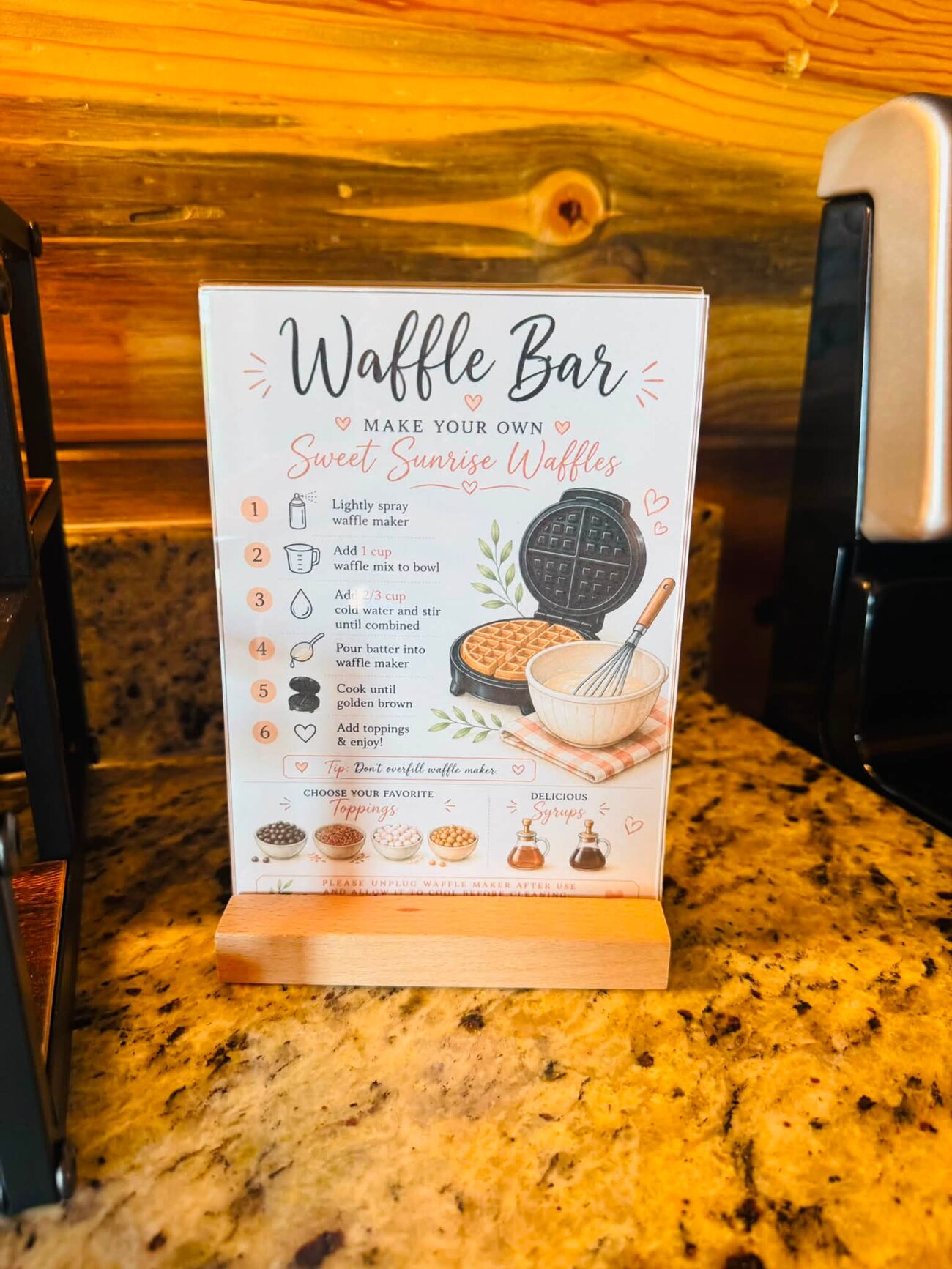 Make Your Own Sweet Sunrise Waffles instruction card in a wood stand on granite
